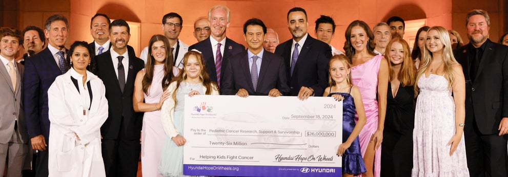 helping kids fight cancer foundation showing their big check from hyundai hope on wheels - Dalton Hyundai National City in National City CA