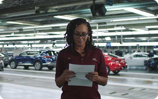 Red Hyundai Elantra at night with Wi-Fi connectivity icon above