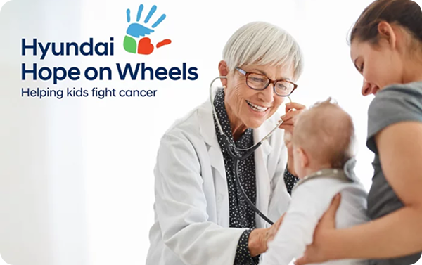 Red Hyundai Elantra at night with Wi-Fi connectivity icon above