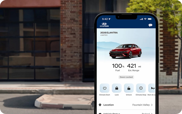 Hyundai Bluelink app on smartphone showing vehicle controls next to red Elantra