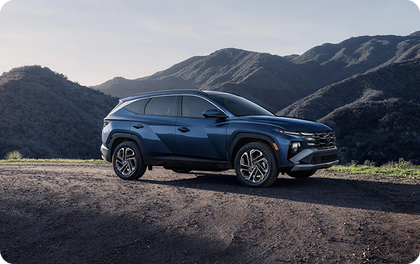 Tucson Hybrid with 19-inch alloy wheels in mountains