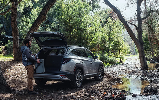 2026 Hyundai TUCSON Plug-in Hybrid with open liftgate in forest
