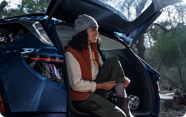 Woman using hands-free smart power liftgate