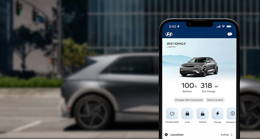 A smartphone showing the Bluelink app with battery and range readouts in front of a parked IONIQ 5