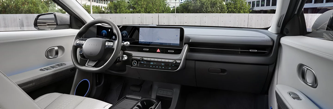 The IONIQ 5 dashboard with its steering wheel and dual 12.3-inch displays