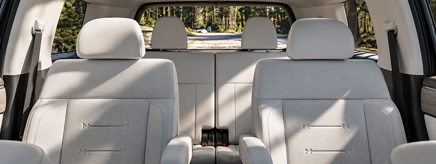 The light gray second- and third-row seats inside the SANTA FE cabin