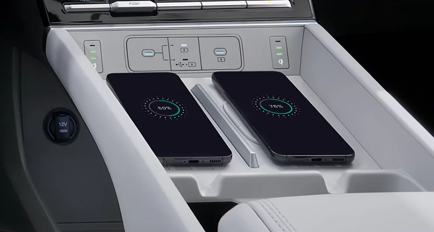 Two smartphones side by side on the SANTA FE dual wireless charging pads