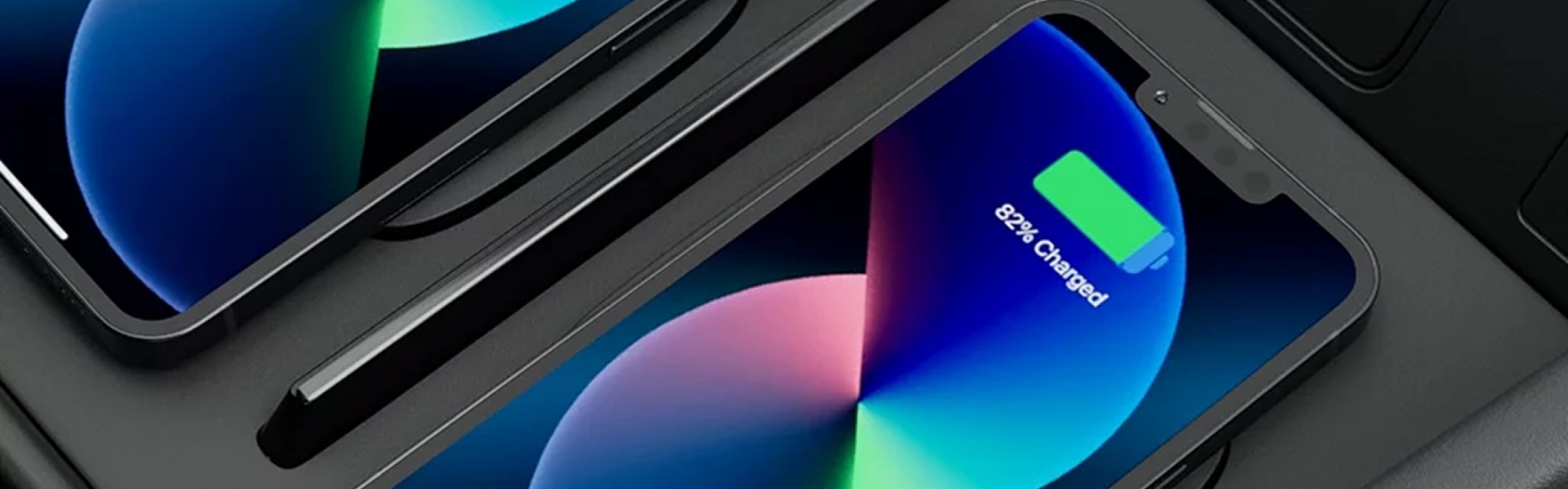 Two smartphones side by side on the SANTA FE Hybrid dual wireless charging pads