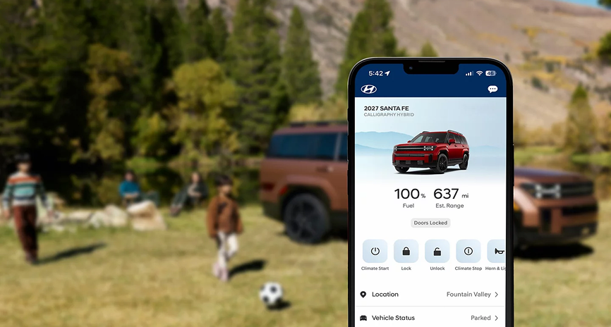 A smartphone showing the Bluelink app in front of a family playing beside a SANTA FE Hybrid