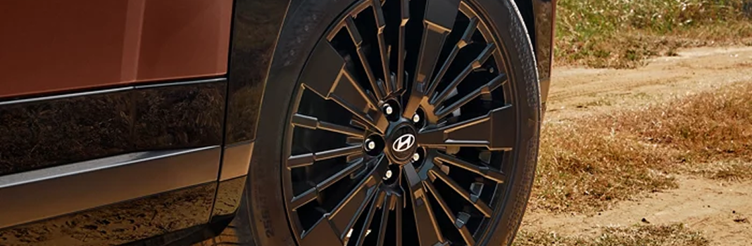 Close-up of a SANTA FE Hybrid alloy wheel and body side