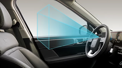 A cabin view with a camera cone from the mirror toward the driver seat
