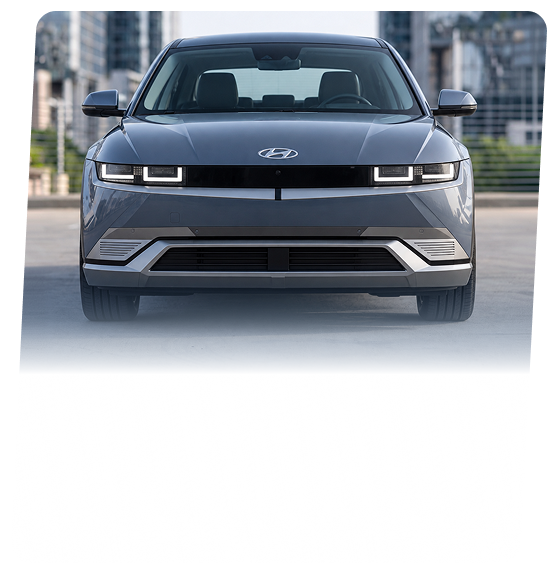 A gray Hyundai IONIQ 5 electric crossover seen head-on on a city street