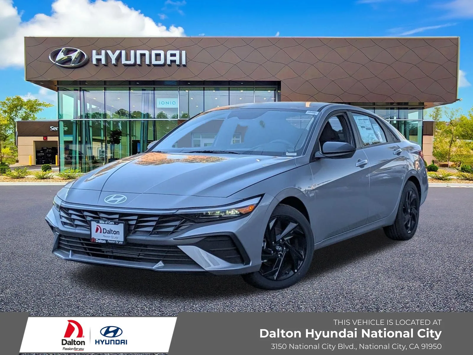 Silver 2026 Hyundai Elantra, front three-quarter view, in front of the Dalton Hyundai National City showroom