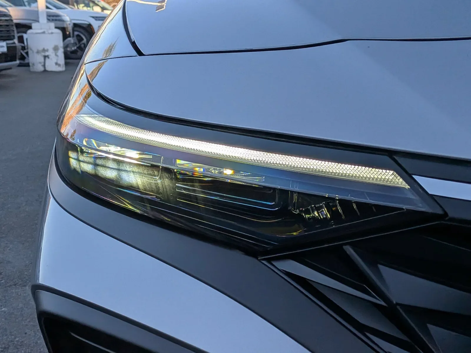Close-up of the LED headlight on a silver 2026 Hyundai Elantra