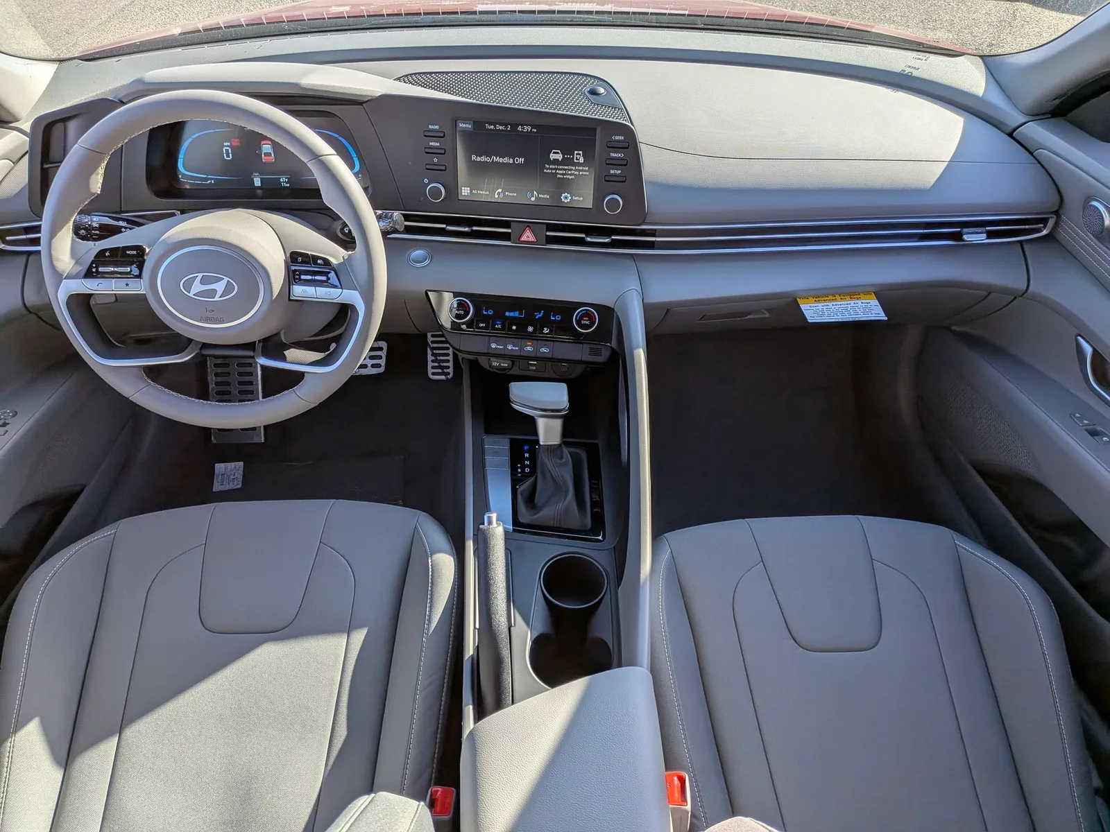 Driver's cockpit of the 2026 Hyundai Elantra showing the steering wheel and pedals