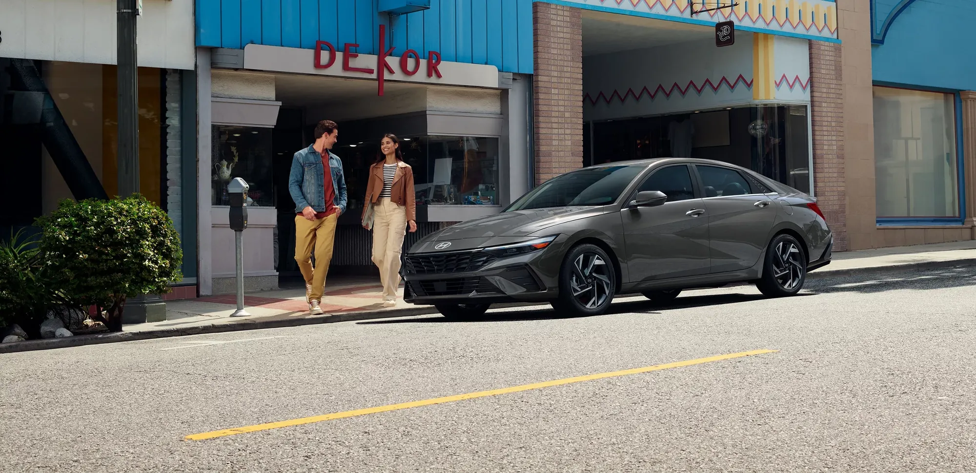 2026 Hyundai Elantra Hybrid on a city street, available to lease at Dalton Hyundai National City