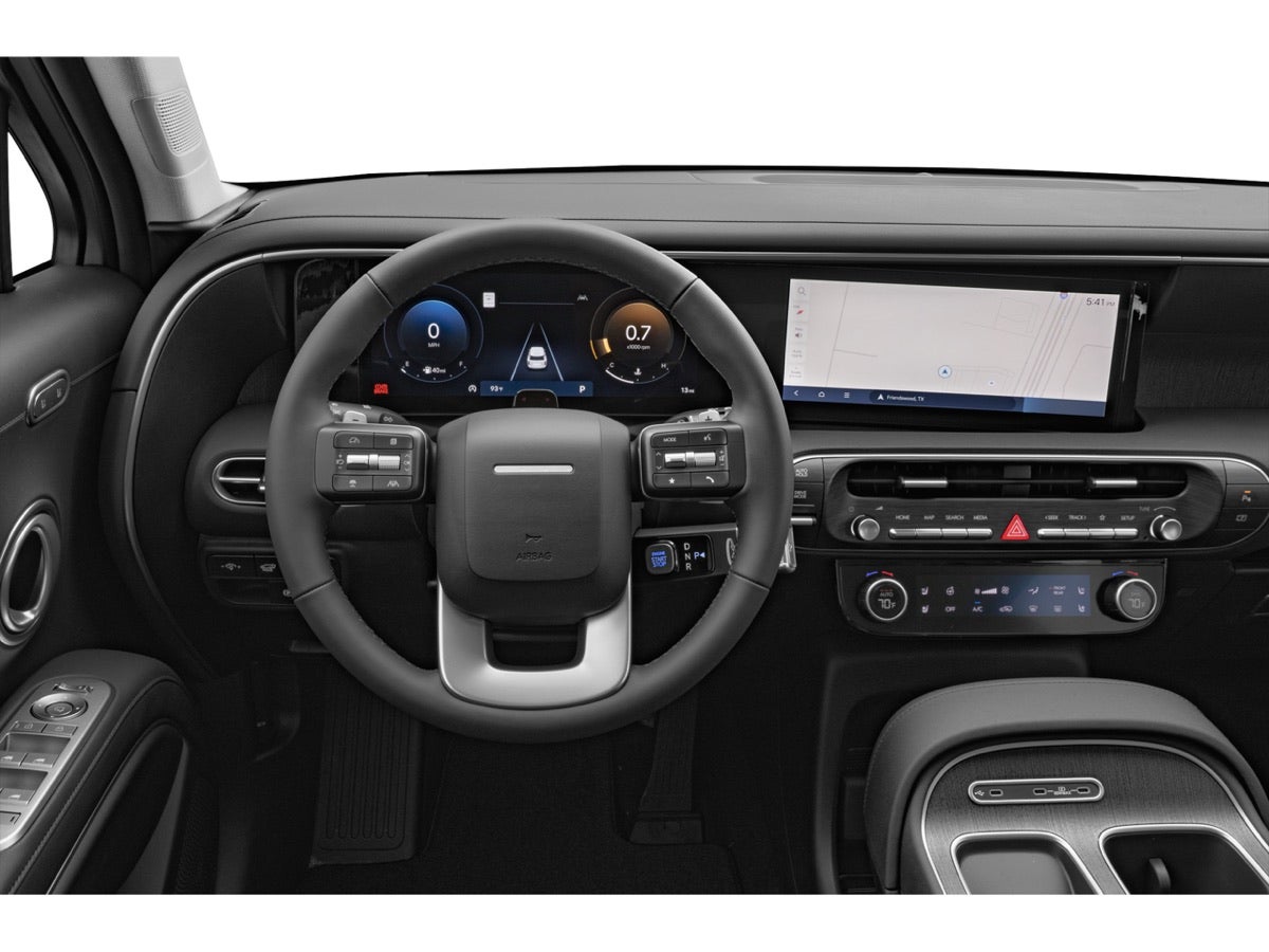 The steering wheel, digital gauge cluster and climate controls of a Hyundai Palisade.