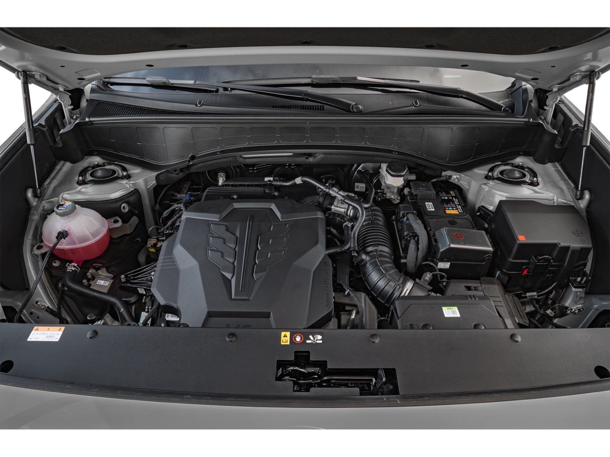 The engine bay of a Hyundai Palisade with the hood open.