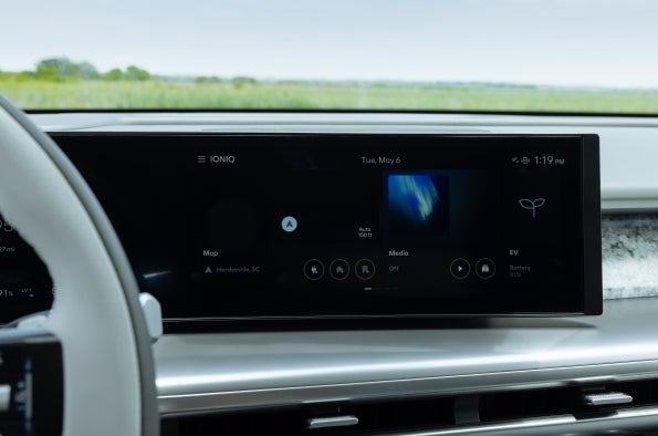 Close-up of the IONIQ 9 center infotainment screen showing the map, media controls, and EV battery status