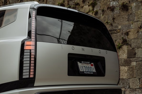 The rear of a Hyundai IONIQ 9, showing the pixel taillight and the IONIQ lettering on the tailgate