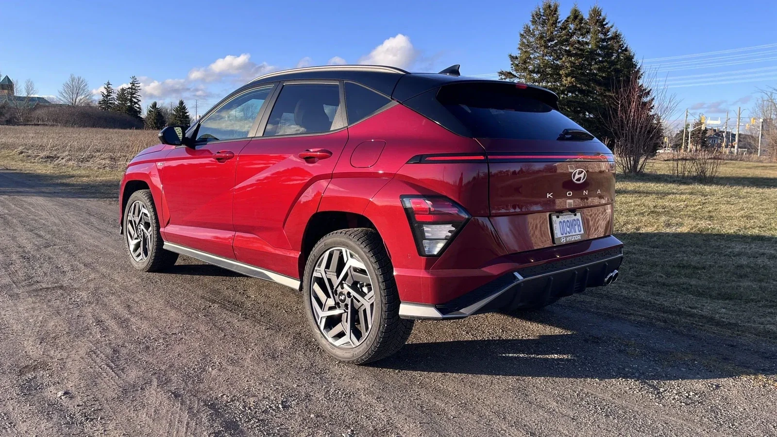 A red Hyundai Kona photographed from the rear three-quarter at Dalton Hyundai National City