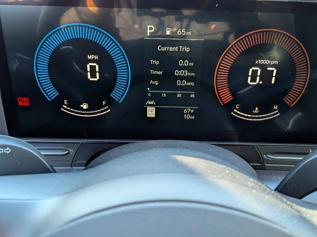 The Hyundai Kona digital instrument cluster showing speed, fuel and current-trip data