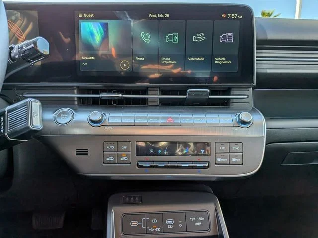 The Hyundai Kona center touchscreen with physical climate and audio controls below it