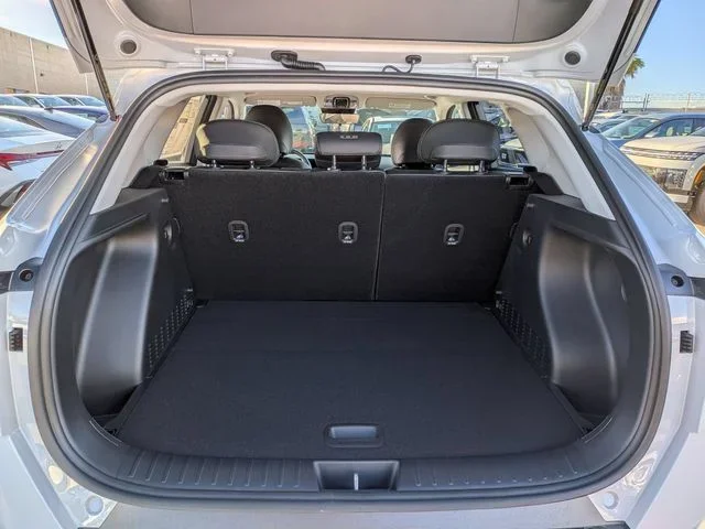 The Hyundai Kona cargo area behind the rear seats, seen through the open tailgate