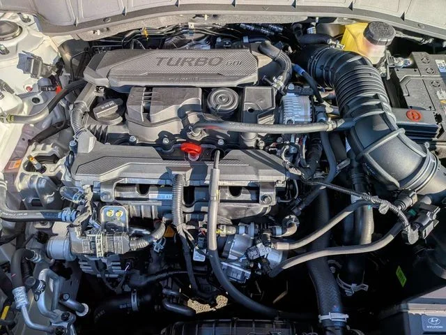 The Hyundai Kona engine bay with the hood open, showing the turbocharged GDI engine cover