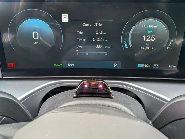 The IONIQ 9 digital instrument cluster showing trip data and remaining driving range